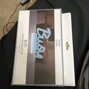 Led sign says “busy” and it glows